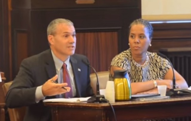Kevin Service (L), vice president, region operations - New York City and Leecia Eve, vice president of government affairs - New York, New Jersey, and Connecticut testify before the City Council of New York.