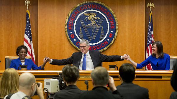 Net Neutrality victory. (Mignon Clyburn (L), Thomas Wheeler (C), and Jessica Rosenworcel (R) celebrate their majority vote in favor of Net Neutrality. (Image: Mark Wilson/Getty Images)