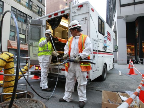 Verizon workers install fiber optic cables in New York City.